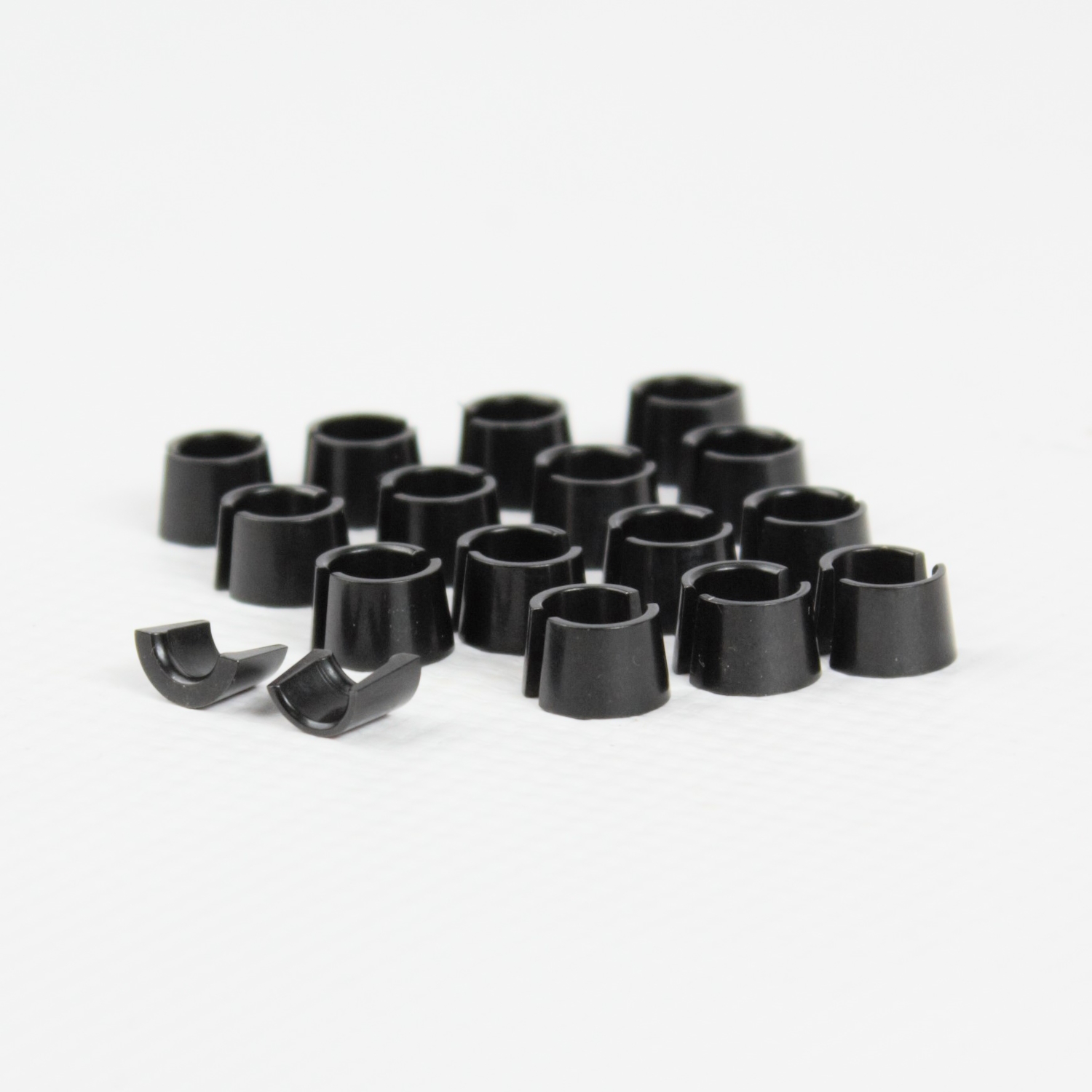 Low-angle close-up of Brian Crower BC2940 5.5mm chromoly valve locks showing precision machined grooves